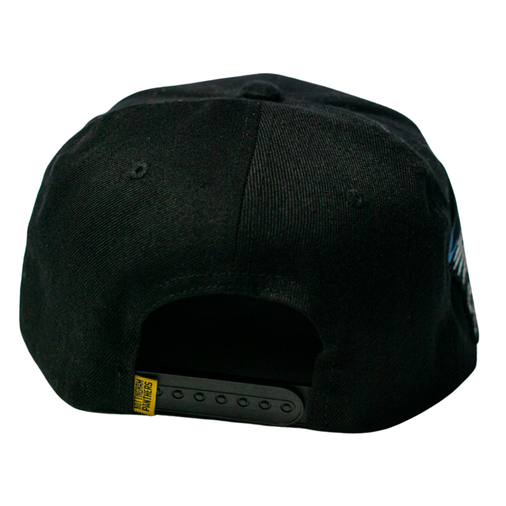 The Nottingham Panthers 25-26 Four Stripe Flatbrim Cap by Panthersland features a black design with an adjustable strap, subtle crest details, and a small yellow tag near the back.