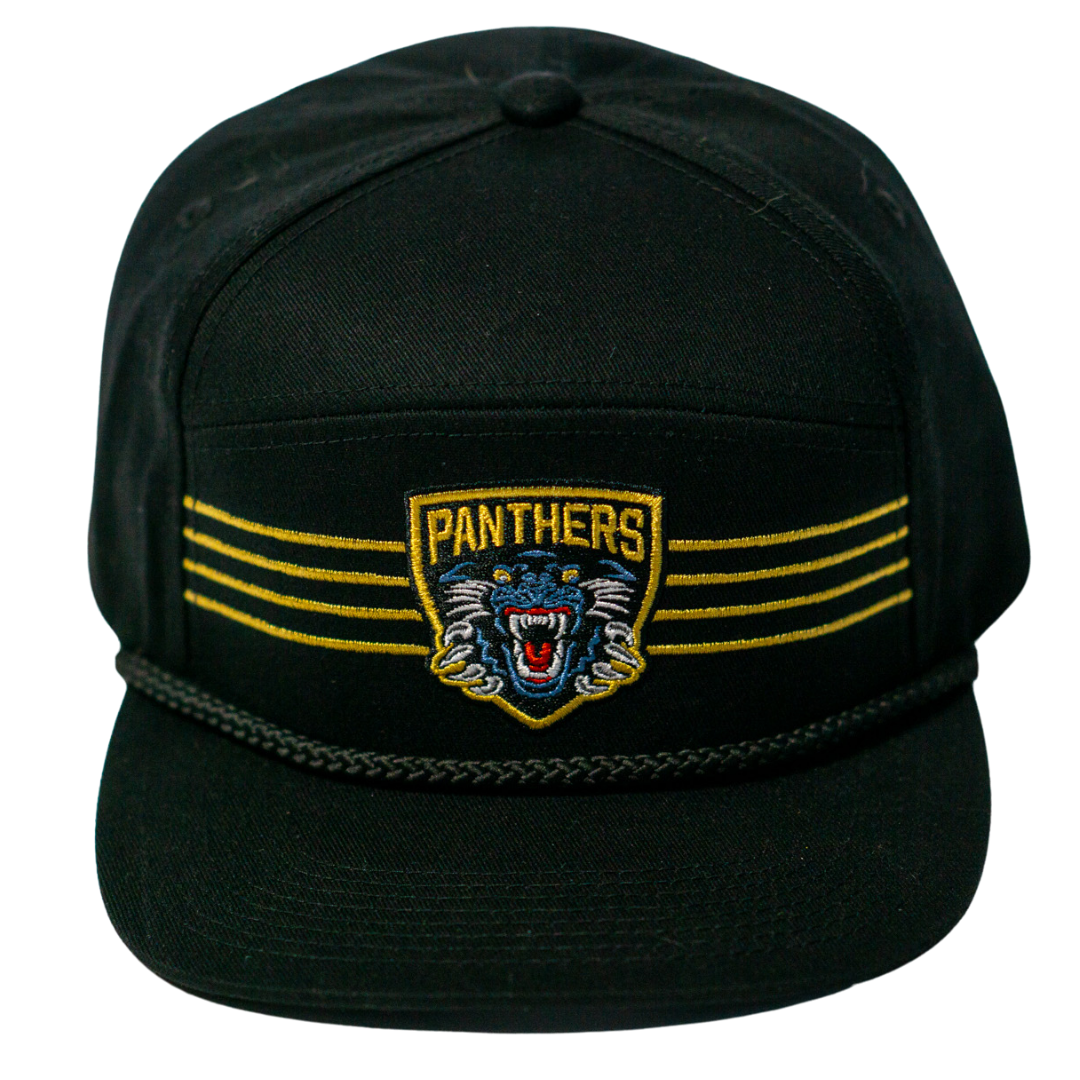 The Panthersland Nottingham Panthers 25-26 Four Stripe Flatbrim Cap features a black design with gold stripes, a Panthers patch above an embroidered growling panther head, and a black braided rope across the front.