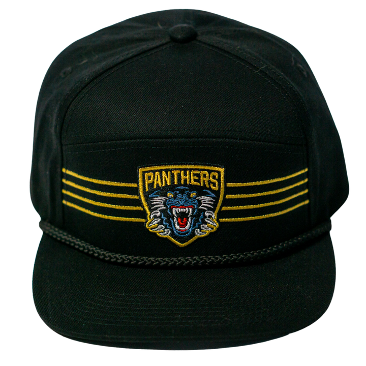 The Panthersland Nottingham Panthers 25-26 Four Stripe Flatbrim Cap features a black design with gold stripes, a Panthers patch above an embroidered growling panther head, and a black braided rope across the front.