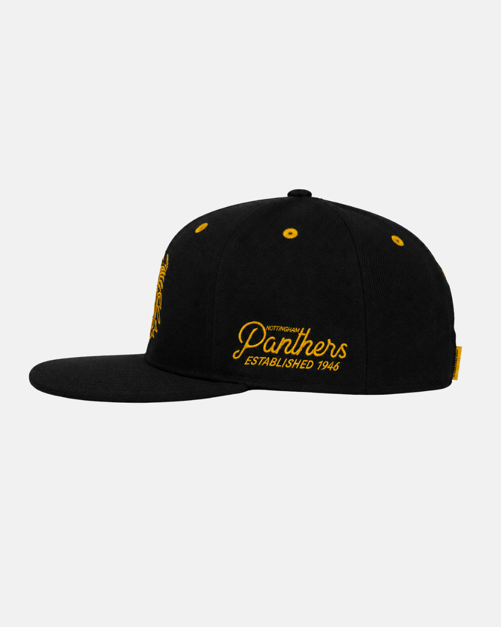 The Panthersland 26-27 Crest Snapback Cap is a black baseball cap featuring yellow embroidery that reads “Panthers Established 1946” on the side. This Nottingham Panthers cap also includes yellow eyelets, a yellow tag, and is photographed against a plain white background.