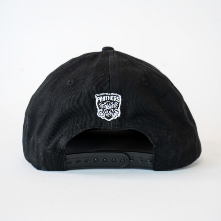 The Made To Order Playoff Champions Panthers 2025 Retro Snapback Cap by Nottingham Panthers features a black & white design with an embroidered panther logo above the adjustable strap—crafted from 100% cotton twill for any fans collection.