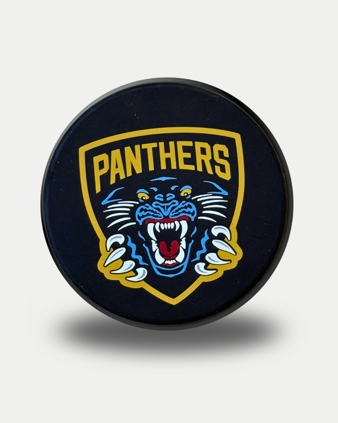 A black Puck Bottle Opener by Panthersland, featuring a snarling panther logo with "PANTHERS" in bold yellow text above the animal on a shield-shaped background.