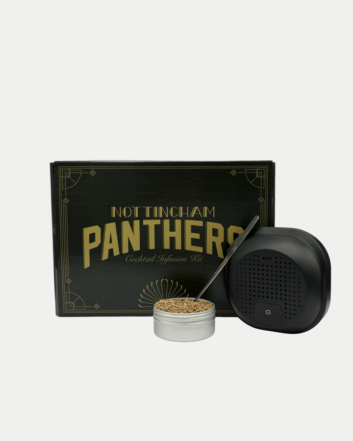 The Nottingham Panthers Whiskey Smoker Kit by Panthersland includes a sleek black box, a tin of wood chips, and a stylish black smoking device, all elegantly displayed on a white background.