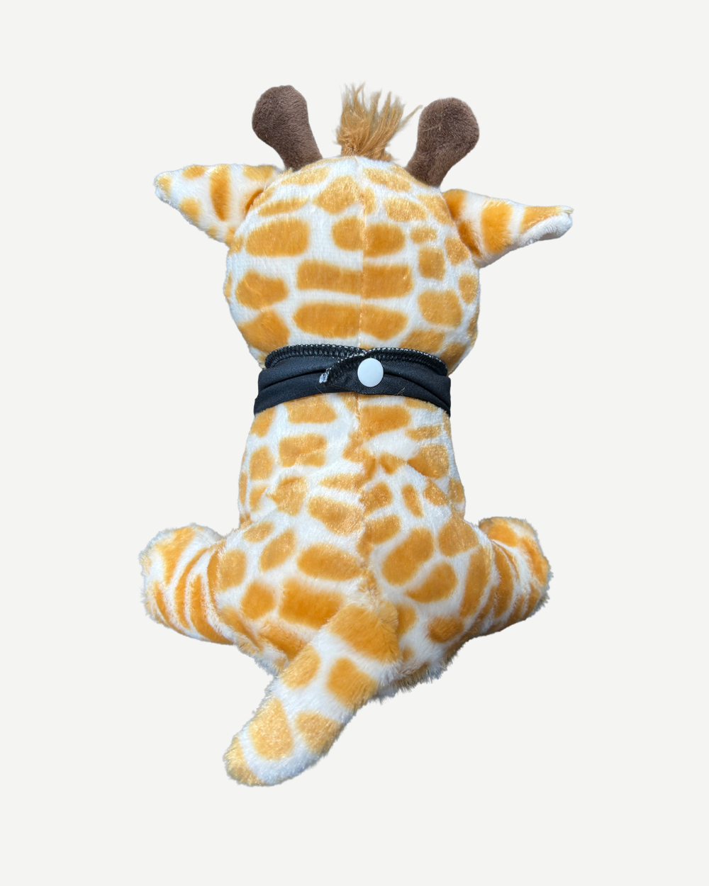 Plush giraffe toy with a black band around its middle on a white background