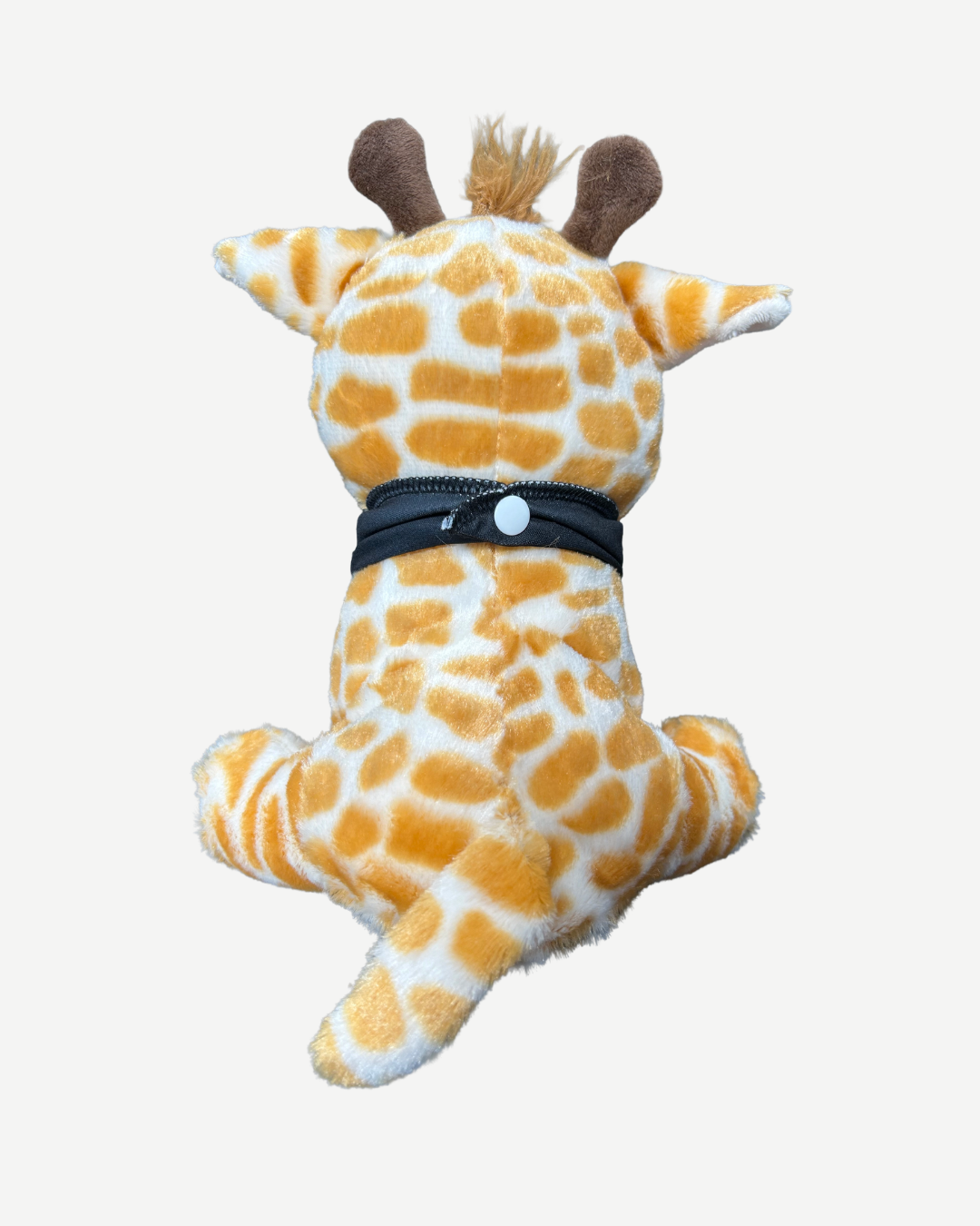 Plush giraffe toy with a black band around its middle on a white background