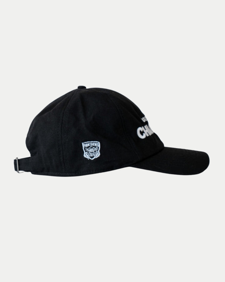 The Made To Order Playoff Champions Panthers 2025 Organic Cotton Dad Cap from Nottingham Panthers features black & white embroidery, an adjustable strap, and a side logo patch. Crafted from 100% organic cotton, it’s eco-friendly and shown in profile on a plain background.