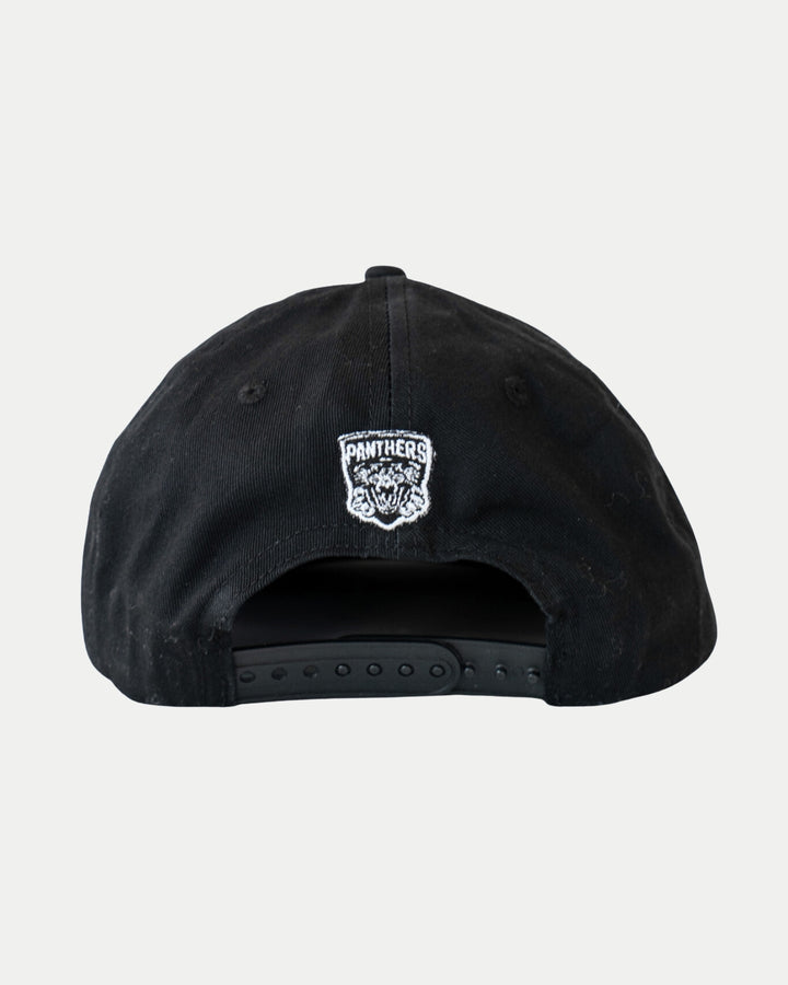 The Nottingham Panthers Made To Order Playoff Champions Panthers 2025 Retro Snapback Cap in black & white features a small embroidered panther head logo above the adjustable strap. Crafted from 100% cotton twill.
