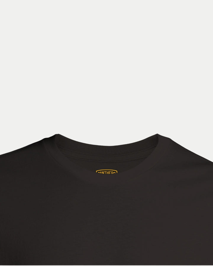 The Made To Order Playoff Champions Panthers 2025 T-shirt Black by Nottingham Panthers is a black unisex crew neck tee with a visible yellow and white inner collar tag, shown on a white background. This style combines comfort with eco-conscious design.
