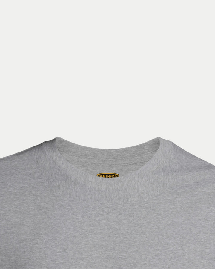 A close-up of the upper part of a light gray Made To Order Playoff Champions Panthers 2025 T-shirt by Nottingham Panthers, showing the collar and a small brand tag inside the neckline against a plain white background.