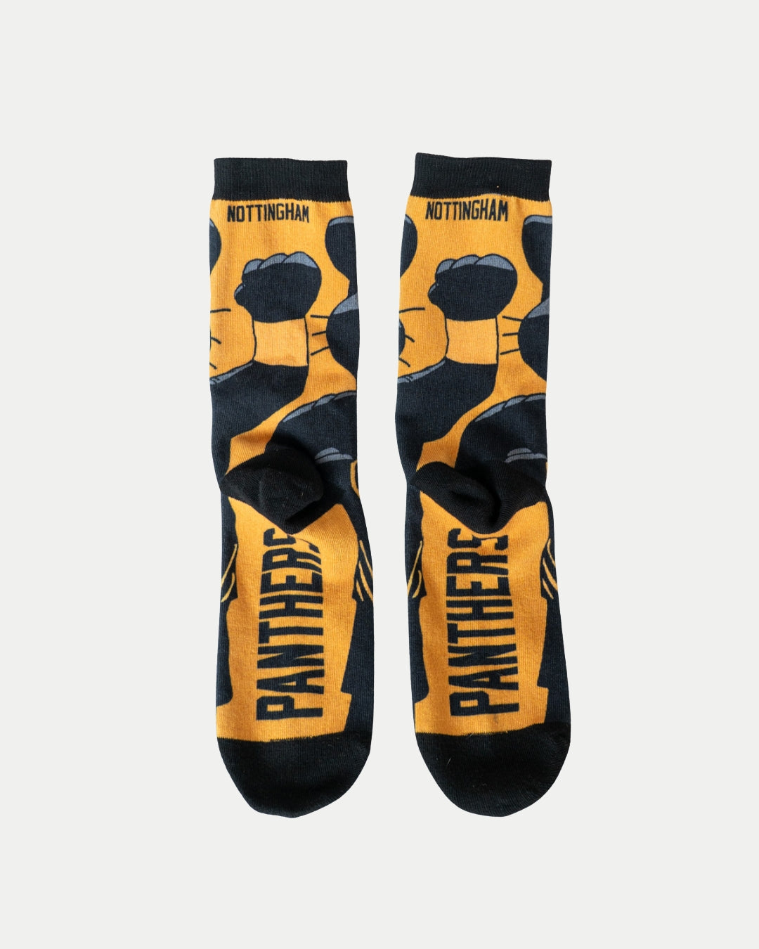 The Nottingham Panthers Paws Socks by Nottingham Panthers are black and gold, featuring a bold paw print design, PANTHERS on the sole, and NOTTINGHAM near the top cuff.