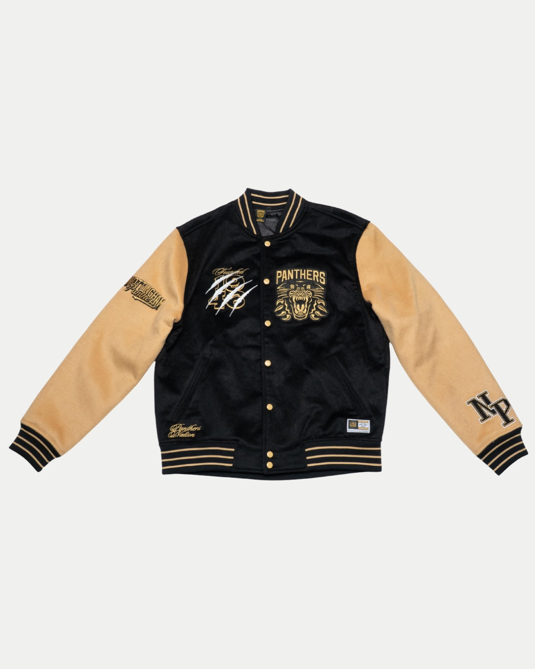 The Panthersland Nottingham Panthers Varsity Jacket Black/Gold 25-26 features gold buttons, black collar and cuffs, plus embroidered patches like the panther logo, NP initials, and other decorative details on front and sleeves.