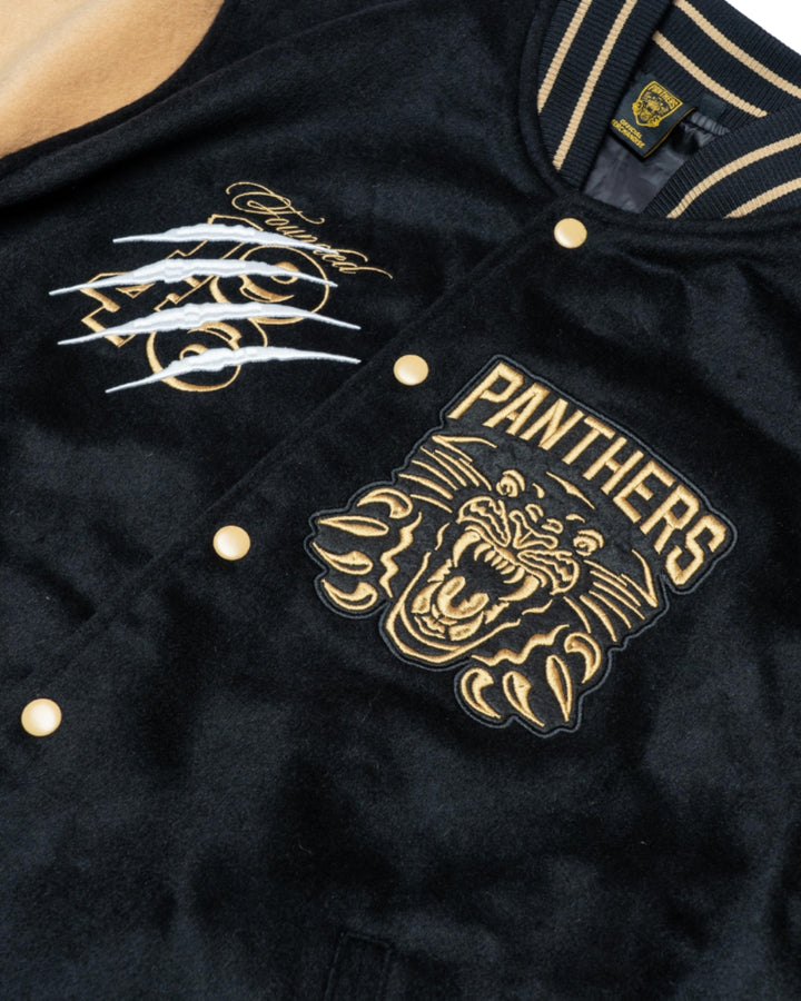 Close-up of the Panthersland Nottingham Panthers Varsity Jacket Black/Gold 25-26, featuring embroidered PANTHERS text above a roaring panther, bold white and gold chest lettering, and striking panther design details.