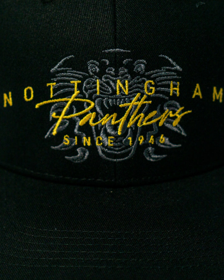 Close-up of the Nottingham Panthers Signature Cap 25-26 by Panthersland, featuring yellow and white Nottingham Panthers Since 1946 embroidery and a panther logo—ideal fan merchandise for supporters.