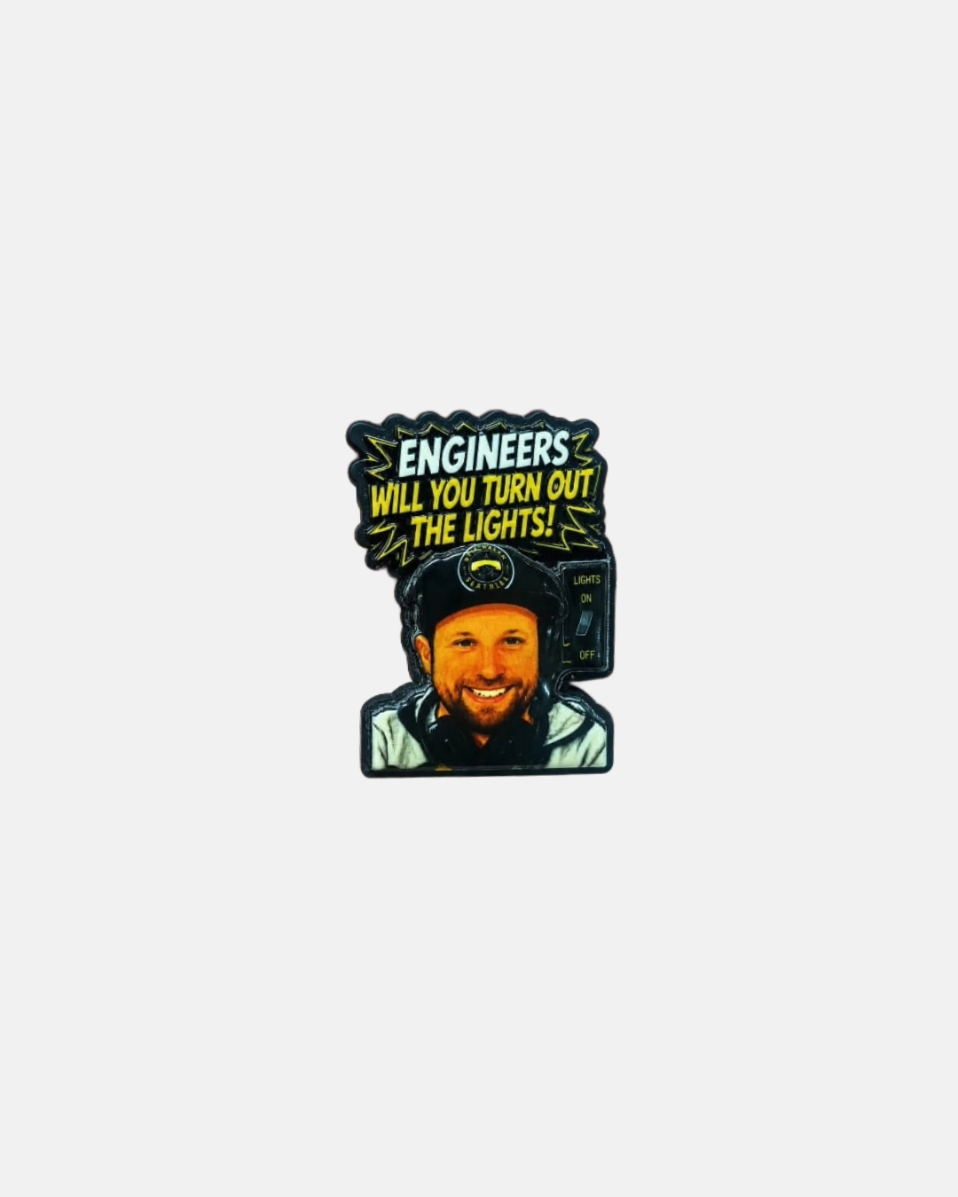 A Nottingham Panthers DJ Ken Croc charm patch from Panthersland features a smiling man wearing headphones and a cap, with the text "ENGINEERS WILL YOU TURN OUT THE LIGHTS!" in yellow letters on a black background above him.