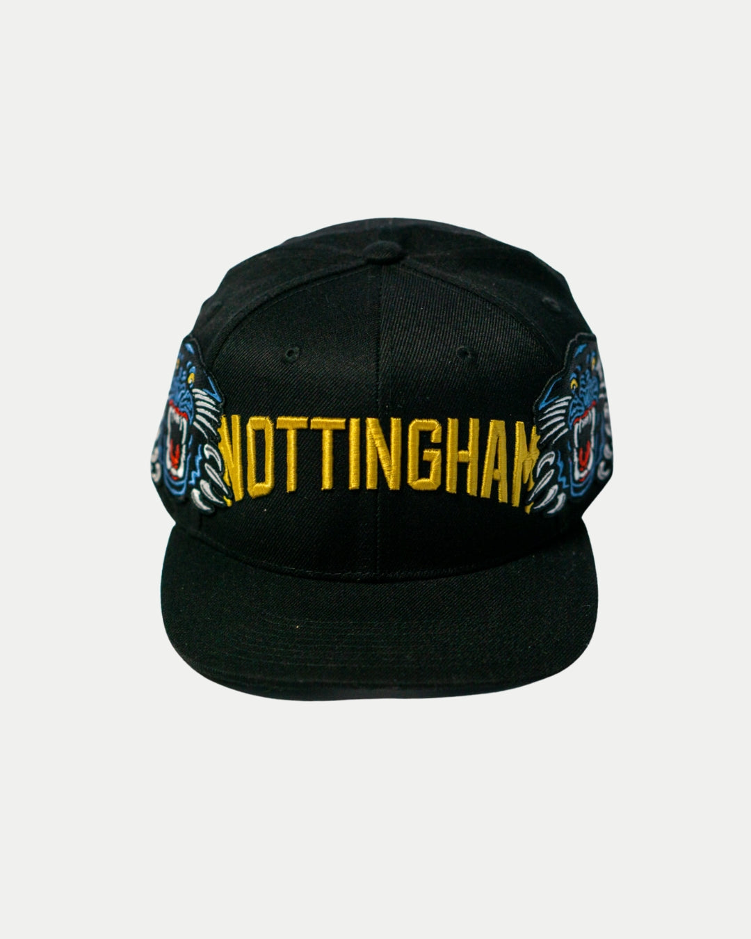The Panthersland Nottingham Panthers 25-26 Big City Text Snapback Cap features NOTTINGHAM in bright yellow and blue panther head accents, making it the ideal standout hat for dedicated Nottingham fans.