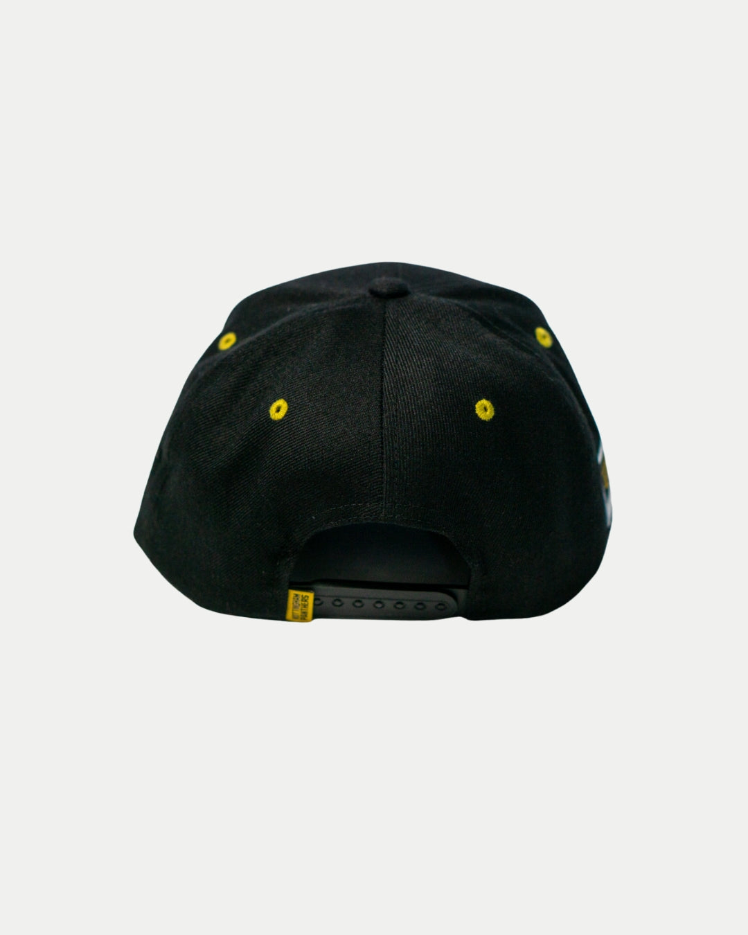 The Panthersland Nottingham Panthers 25-26 Script Snapback Cap features gold embroidery, yellow eyelets, and a black adjustable strap—ideal for Nottingham Panthers fans.