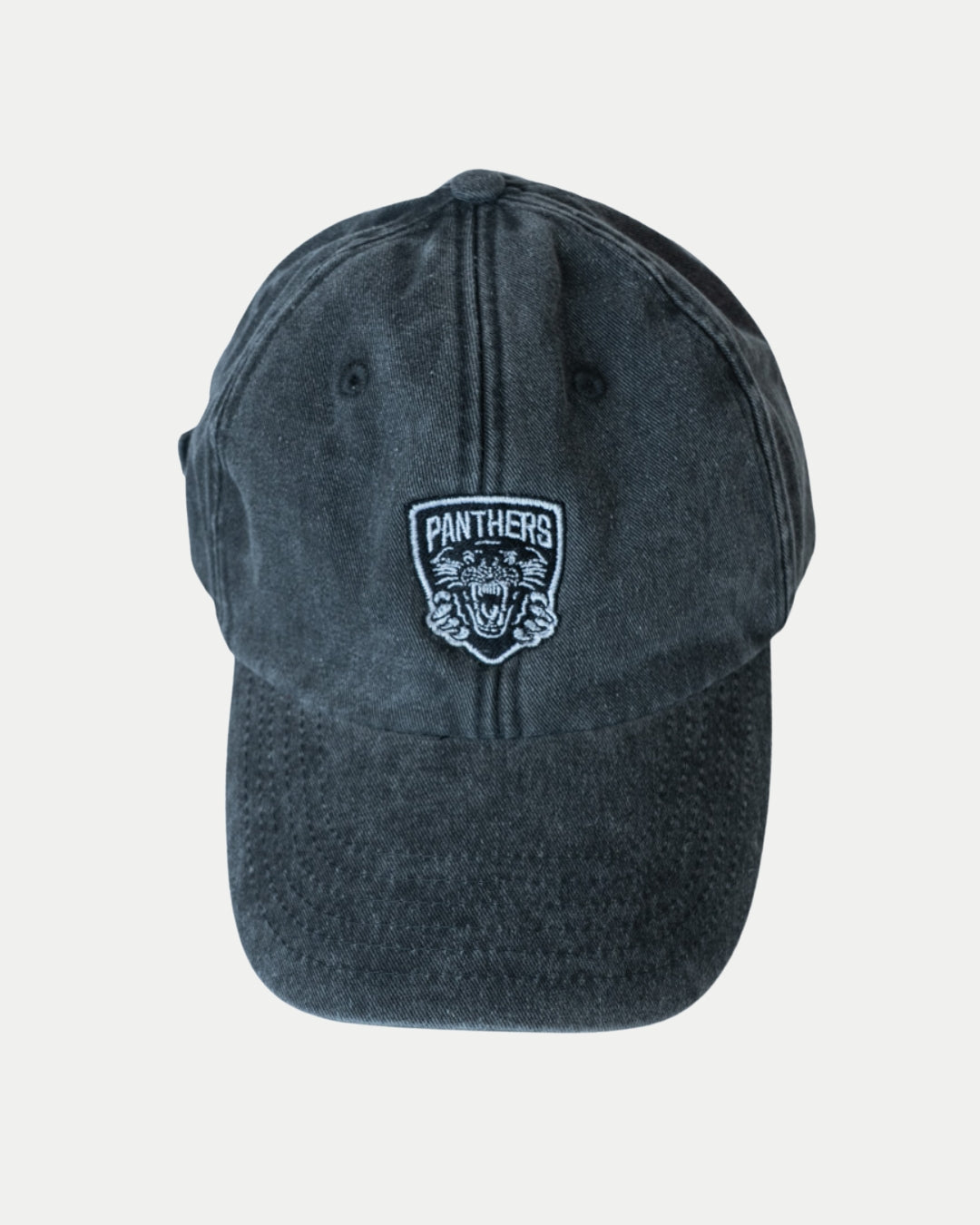 The Nottingham Panthers Made To Order Vintage Cotton Dad Hat in vintage black features a white embroidered Panthers patch with an illustrated panther head, shown against a plain white background.