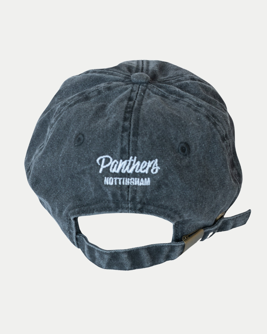 The Nottingham Panthers Made To Order Vintage Cotton Panthers Dad Hat in vintage black features white Panthers Nottingham embroidery above an adjustable strap with metal clasp, offering a classic, customizable look.