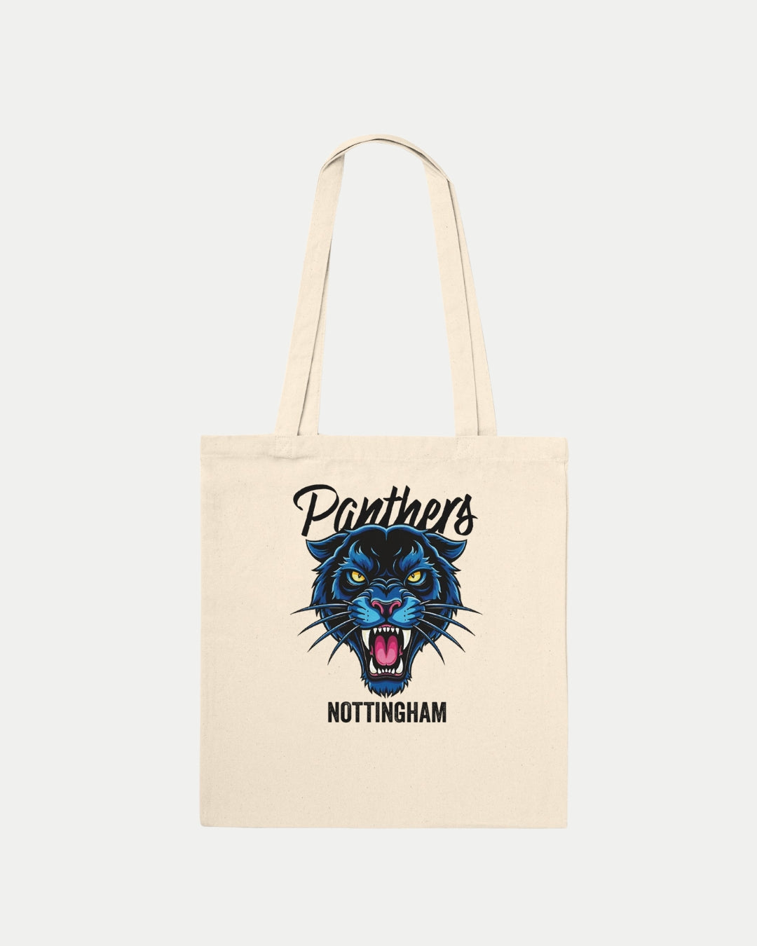 The Made To Order Panthers Graphic Tote Bag Natural by Nottingham Panthers is a cream cotton tote featuring a bold blue and black panther head graphic, Panthers above, and Nottingham below—perfect for eco-conscious fans.
