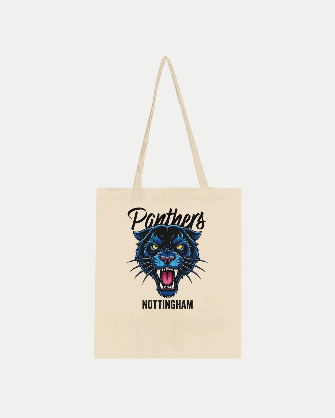 The Made To Order Panthers Graphic Tote Bag Natural by Nottingham Panthers is a beige, 100% cotton tote with long handles, featuring a roaring blue panther face and Panthers above, Nottingham below the illustration on the front.