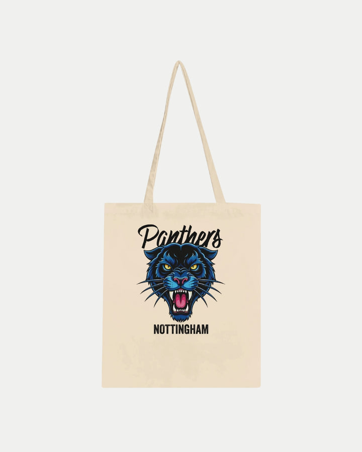 The Made To Order Panthers Graphic Tote Bag Natural by Nottingham Panthers is a beige, 100% cotton tote with long handles, featuring a roaring blue panther face and Panthers above, Nottingham below the illustration on the front.