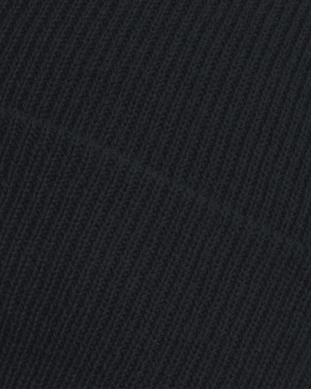 Close-up of the ribbed knit fabric on the Nottingham Panthers Made To Order Logo Cuffed Beanie Black, showing detailed loops, stitches, and a diagonal seam that highlight its thick acrylic texture.