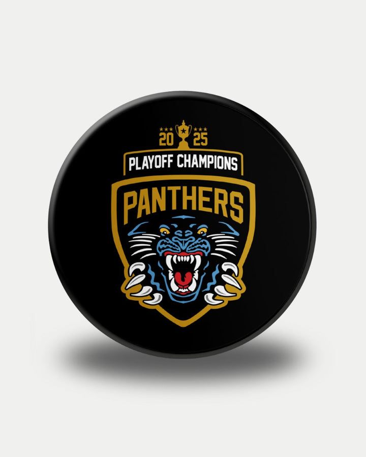 The Panthersland Panthers 2025 Playoff Champions Puck is black, showcasing a fierce panther logo, PANTHERS and PLAYOFF CHAMPIONS, plus a gold 2025 with a trophy icon above the text.