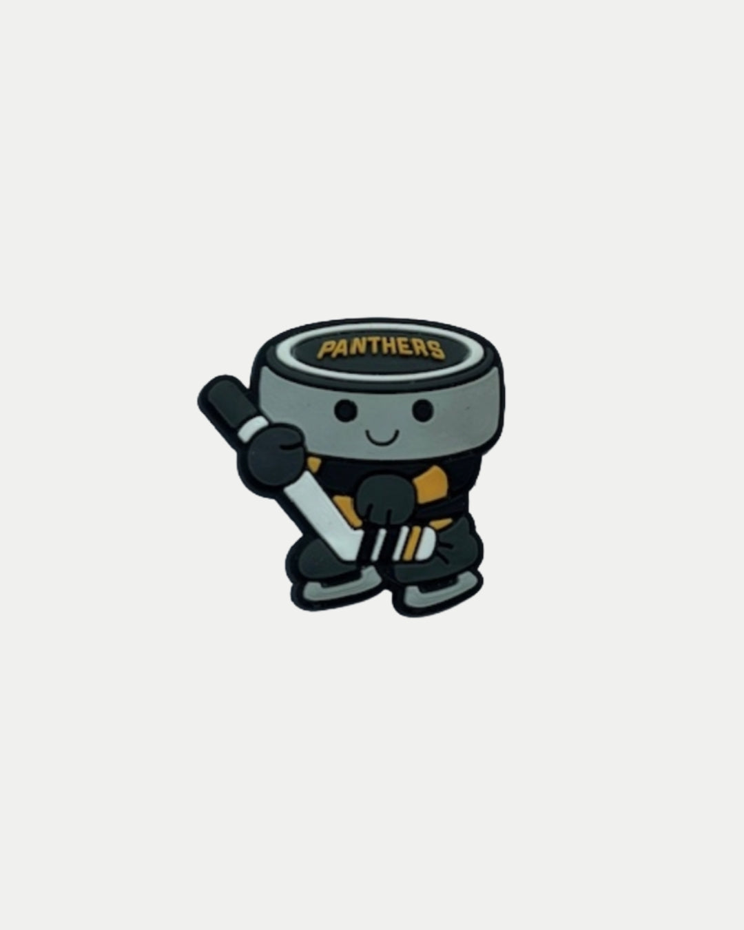 Show your team spirit with the Nottingham Panthers 25-26 Puck Croc Charm by Panthersland—a cute cartoon puck character in a black and yellow uniform, smiling and holding a hockey stick.