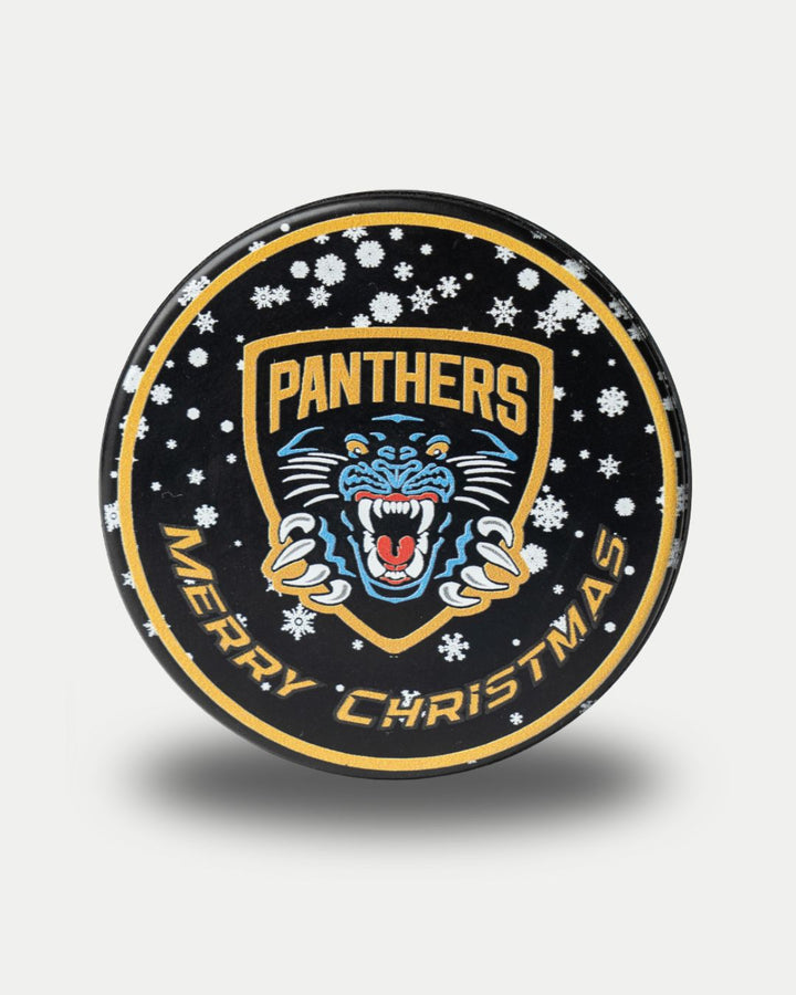 The Nottingham Panthers Christmas Puck features a snarling panther logo, PANTHERS, festive snowflakes, and Merry Christmas around the edge on a black background.