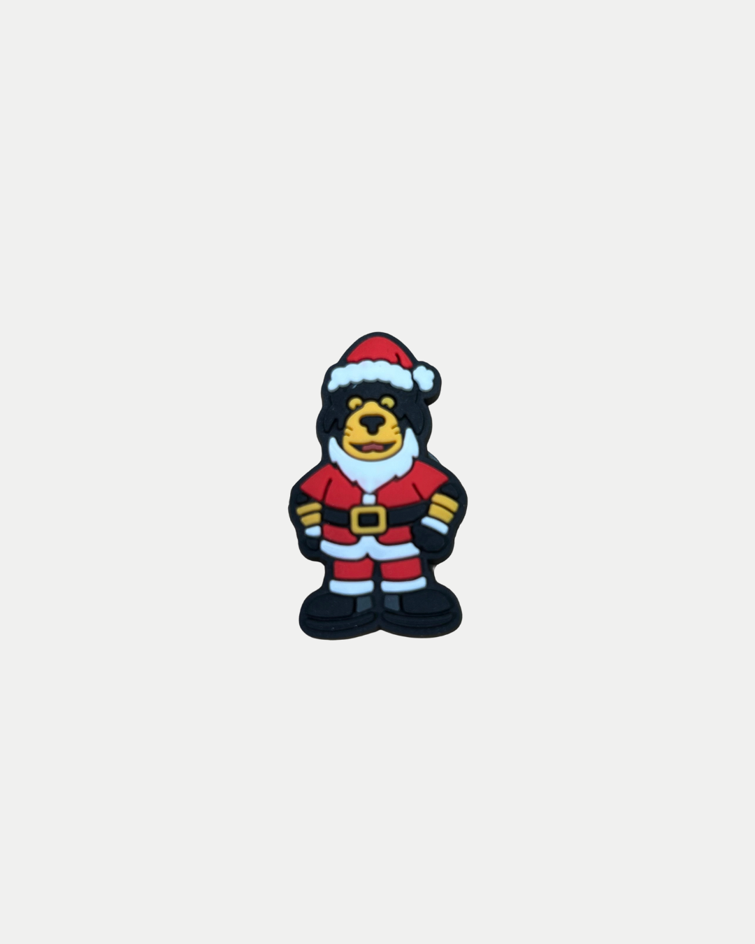 The Santa Paws Croc Charm by Panthersland features a cartoon bear in a red Santa suit with black boots and a yellow belt, making it the perfect accessory for Nottingham Panthers fans.