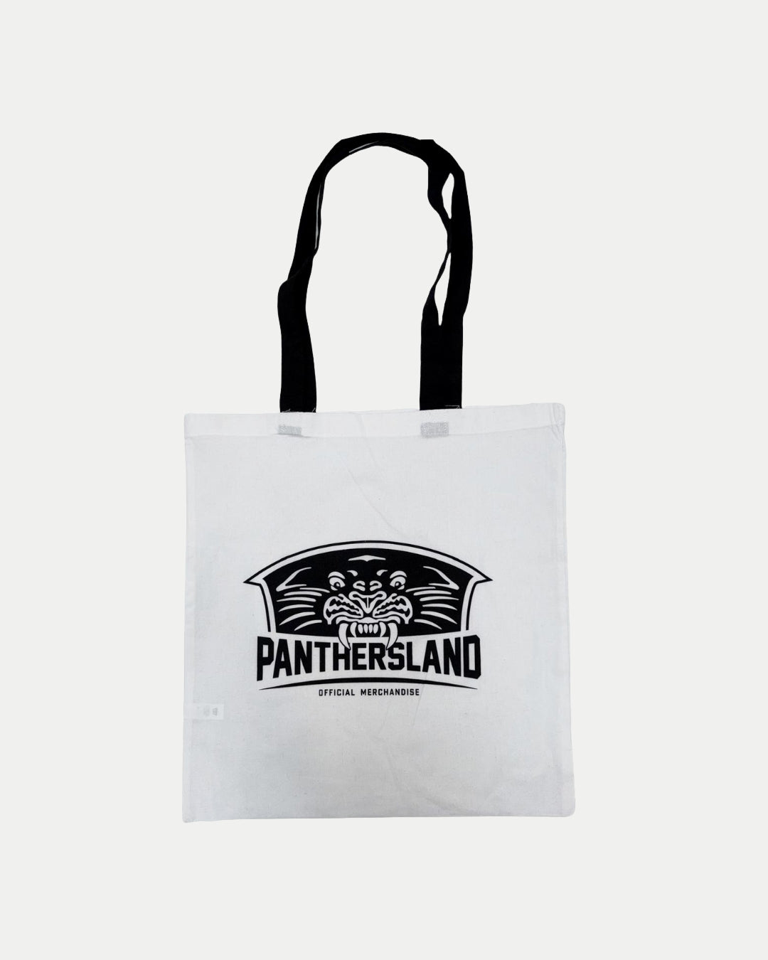 The Panthersland Tote Bag by Panthersland features black handles, a bold panther logo, and PANTHERSLAND OFFICIAL MERCHANDISE printed on a plain white background.