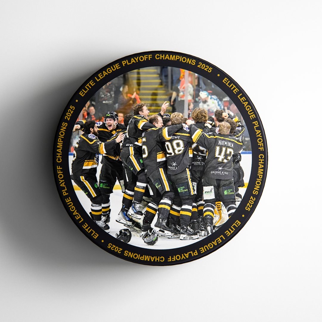 The Nottingham Panthers celebrate on ice in black and yellow, hugging and cheering. The round frame reads “ELITE LEAGUE PLAYOFF CHAMPIONS 2025” in gold—perfect for fans collecting the Panthersland Playoff Team Winning Puck 2025.
